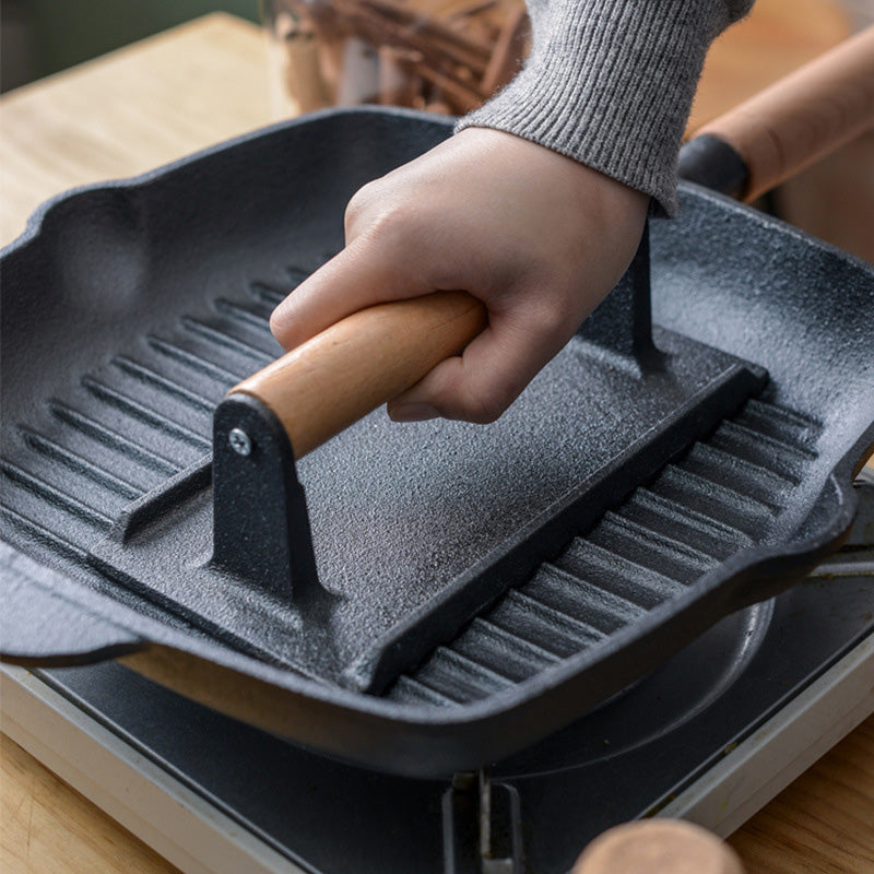 Presse à steak et à hamburger en fonte avec manche en bois